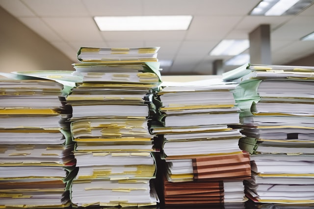 Paper stacked on a desk